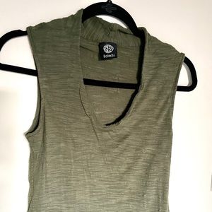 Hunter green tank with wider sleeves that cover shoulders and plunging neckline!
